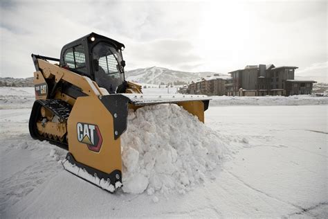 cat skid steer plowing snow|cat snow plow prices.